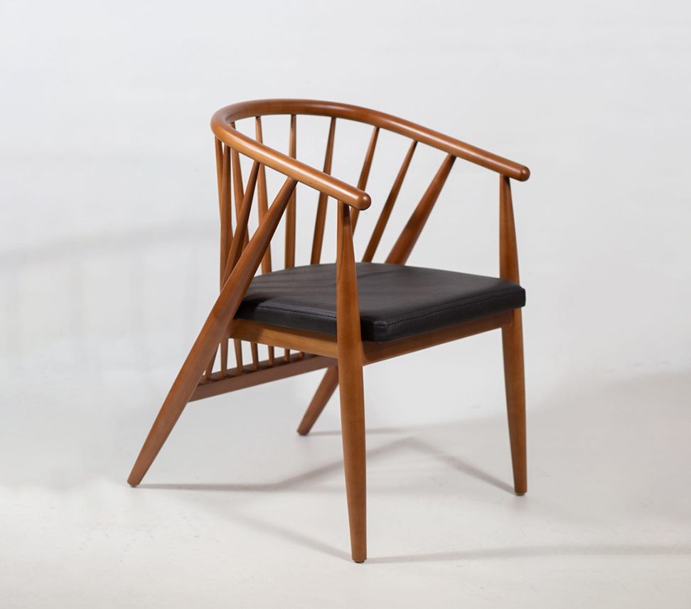 Wooden custom made chair with black cushioned seat.