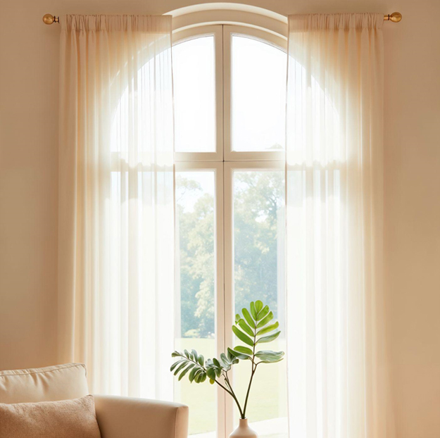 Light sheer curtains in Dubai apartment allowing soft natural light while maintaining privacy.