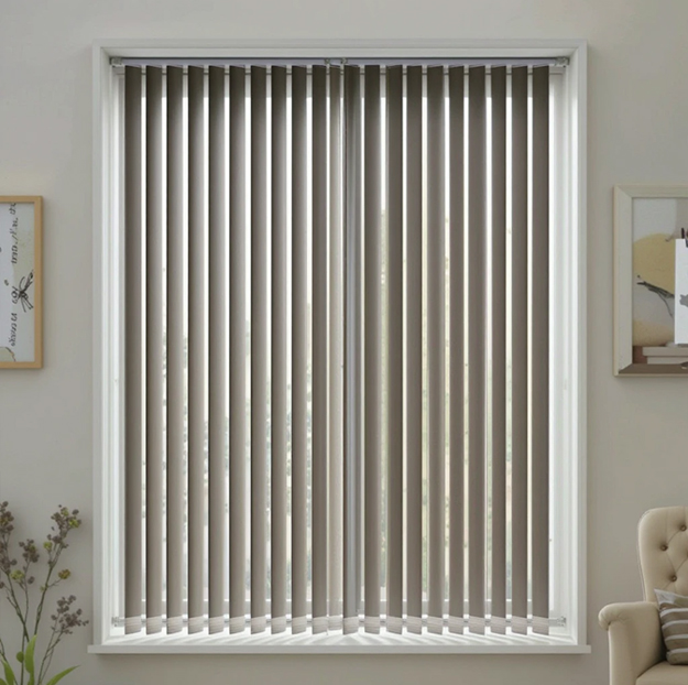 Vertical blinds in Dubai commercial space with adjustable panels for large windows.