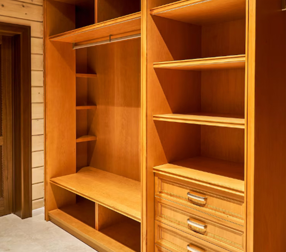 Spacious wooden custom made wardrobe with shelves and drawers.