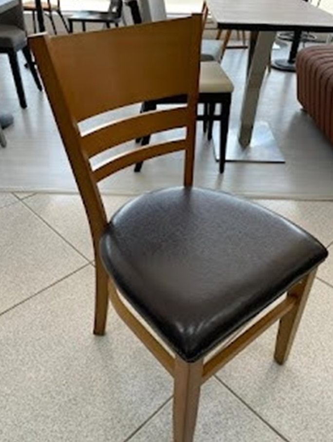 Wooden dining chair with black leather upholstered seat and simple backrest design