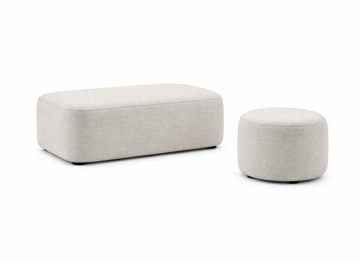 Upholstered ottoman and pouf seating with soft fabric finish for office lounge areas