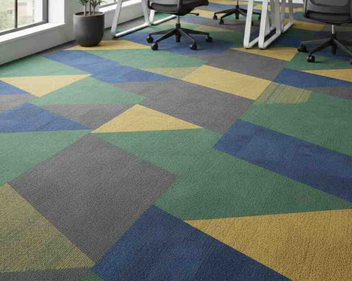 Modular carpet tiles in office interior with colorful, flexible tile layout.