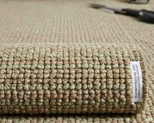 Olefin polypropylene carpet roll with textured, water-resistant fiber surface.