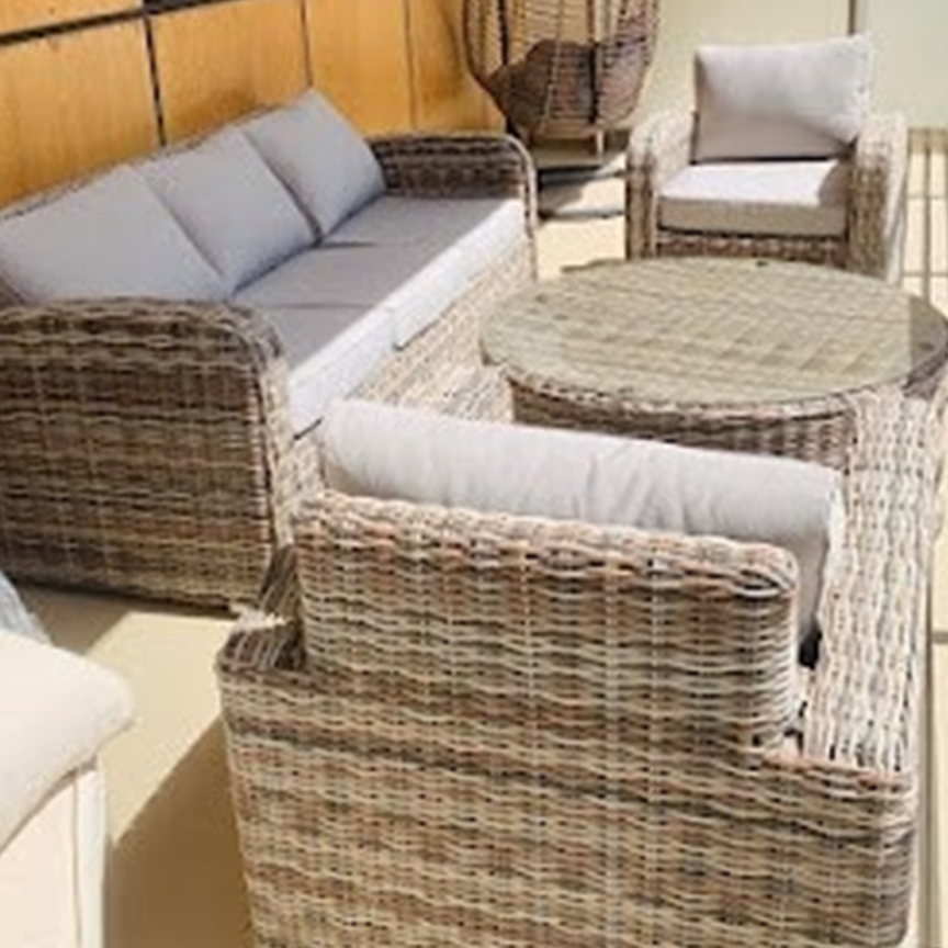 Durable custom made rattan sofa set with cushioned chairs for patio lounge area