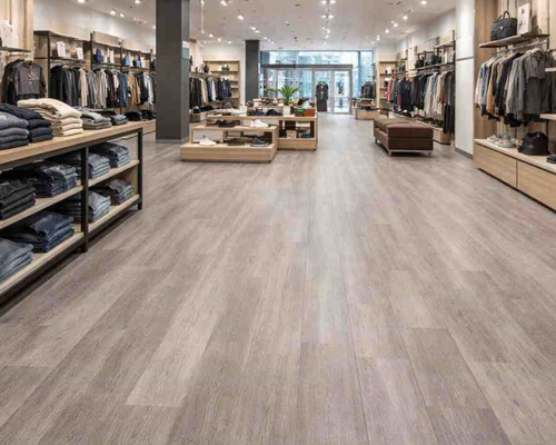 Commercial vinyl flooring in a retail clothing store designed for high-traffic durability and easy maintenance.