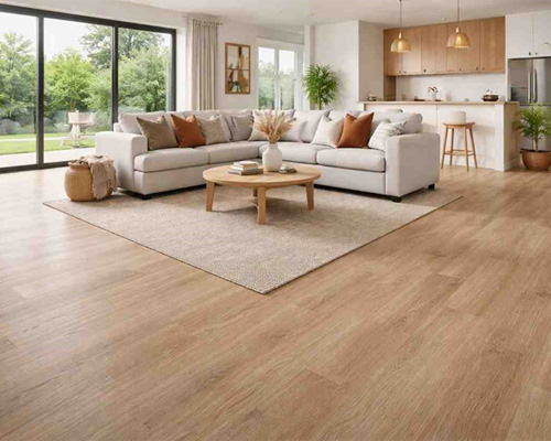 Modern living room with seamless sheet vinyl flooring in light wood finish and open kitchen layout.