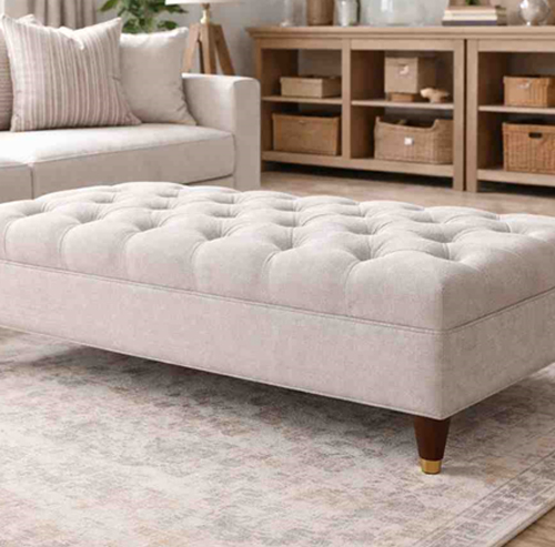 Custom made cocktail ottoman with tufted upholstery for modern living room centerpiece