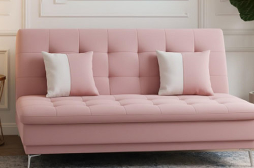 Soft pink click-clack sofa bed with tufted seat and adjustable backrest
