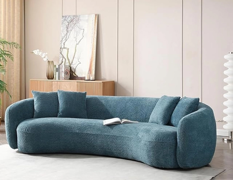 Curved sofa upholstery with modern rounded design and smooth fabric finish