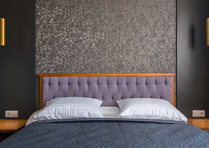 Upholstered bed headboard with modern bedroom interior design