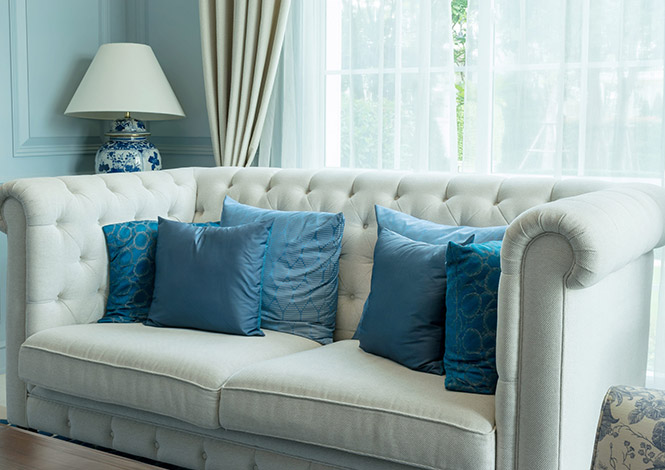 Modern fabric sofa upholstery with cushions in stylish living room