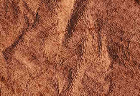 Crushed leather upholstery with distressed textured finish