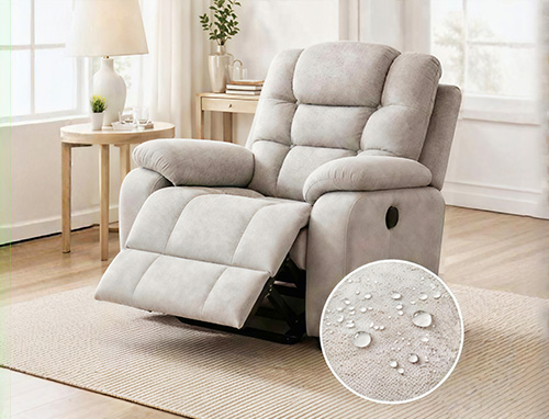Recliner chair with performance fabric and extended footrest, designed for durability and easy maintenance